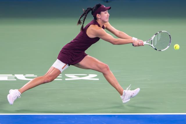 (261012) -- WUHAN, Oct. 12, 2026 (Xinhua) -- Wang Xinyu hits a return during the women's sinlges round of 64 match between Wang Xiyu of China and Wang Xinyu of China of the 2026 Wuhan Open tennis tournament in Wuhan, capital of central China's Hubei Province, Oct. 12, 2026. (Xinhua/Du Zixuan)