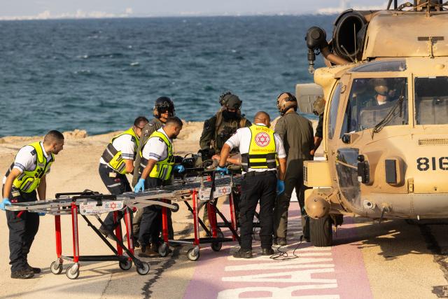 (261012) -- HAIFA, Oct. 12, 2026 (Xinhua) -- An injured person is transferred to Rambam Hospital in Haifa, northern Israel, Oct. 12, 2026. One person was killed and 19 others injured in an explosion of unexploded ordnance during a school trip in northern Israel on Monday, Israeli police and the national emergency service Magen David Adom said in separate statements. (JINI via Xinhua)