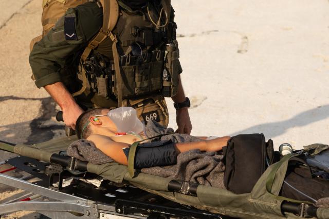 (261012) -- HAIFA, Oct. 12, 2026 (Xinhua) -- An injured person is transferred to Rambam Hospital in Haifa, northern Israel, Oct. 12, 2026. One person was killed and 19 others injured in an explosion of unexploded ordnance during a school trip in northern Israel on Monday, Israeli police and the national emergency service Magen David Adom said in separate statements. (JINI via Xinhua)