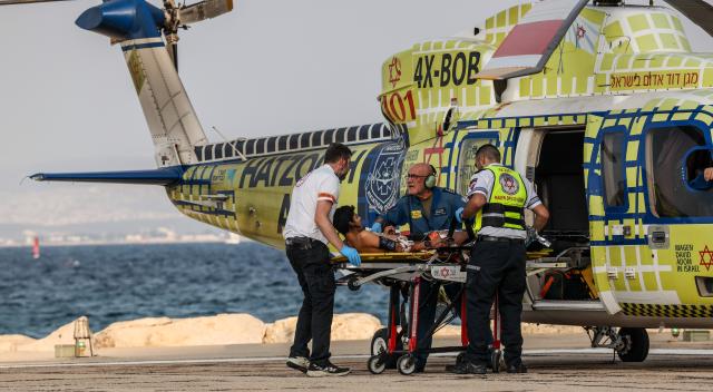 (261012) -- HAIFA, Oct. 12, 2026 (Xinhua) -- An injured person is transferred to Rambam Hospital in Haifa, northern Israel, Oct. 12, 2026. One person was killed and 19 others injured in an explosion of unexploded ordnance during a school trip in northern Israel on Monday, Israeli police and the national emergency service Magen David Adom said in separate statements. (JINI via Xinhua)