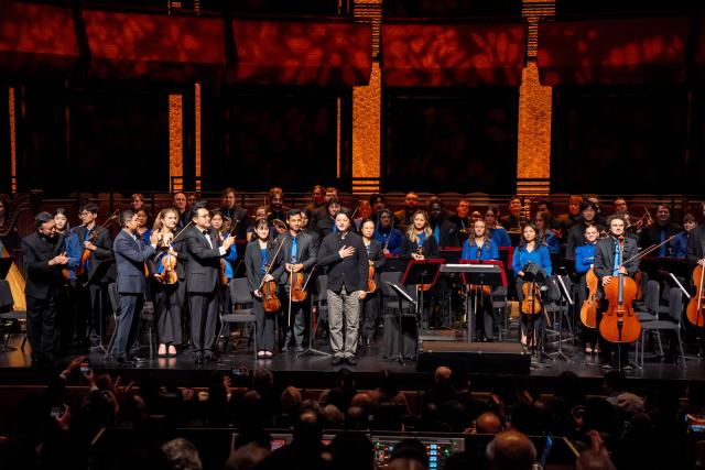 (261012) -- NEW YORK, Oct. 12, 2026 (Xinhua) -- Chinese composer Li Shaosheng (C) greets to the audience after the premiere of symphonic suite Chasing the Sky, during the ninth China Now Music Festival at Lincoln Center in New York, the United States, Oct. 11, 2026. The ninth China Now Music Festival concluded Sunday at Lincoln Center in New York City with a concert showcasing the resilience and aspirations that connect the American and Chinese peoples. (Photo by Zack Zhang/Xinhua)