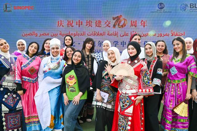 (261012) -- CAIRO, Oct. 12, 2026 (Xinhua) -- Egyptian students pose for a group photo during a Chinese culture festival at Badr University in Cairo, Egypt, Oct. 12, 2026. A Chinese culture festival was held Monday at Badr University in Cairo to celebrate the 70th anniversary of the establishment of diplomatic relations between China and Egypt, featuring cultural performances, traditional Chinese arts and student exchanges. (Xinhua/Xin Mengchen)