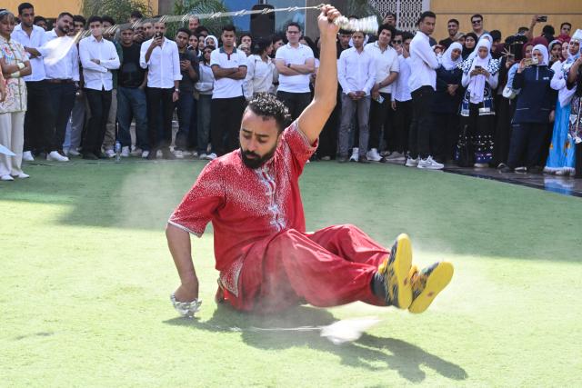 (261012) -- CAIRO, Oct. 12, 2026 (Xinhua) -- An Egyptian student performs martial arts during a Chinese culture festival at Badr University in Cairo, Egypt, Oct. 12, 2026. A Chinese culture festival was held Monday at Badr University in Cairo to celebrate the 70th anniversary of the establishment of diplomatic relations between China and Egypt, featuring cultural performances, traditional Chinese arts and student exchanges. (Xinhua/Xin Mengchen)