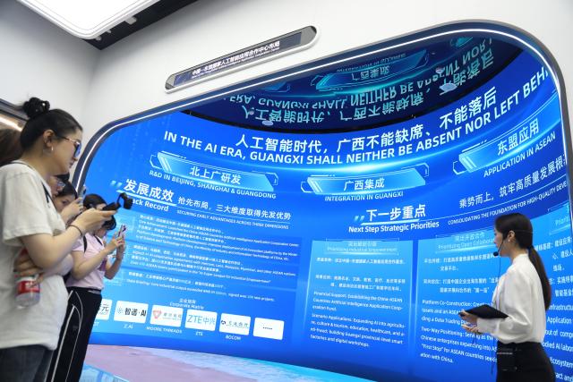 (261013) -- NANNING, Oct. 13, 2026 (Xinhua) -- Media professionals visit the China-ASEAN Countries Artificial Intelligence (AI) Application Cooperation Center in Nanning, south China's Guangxi Zhuang Autonomous Region, Oct. 12, 2026. Located in Nanning City, the China-ASEAN Countries Artificial Intelligence (AI) Application Cooperation Center serves as an important platform for south China's Guangxi Zhuang Autonomous Region to implement the national AI development strategy and deepen China-ASEAN cooperation in AI. (Xinhua/Lu Peng)