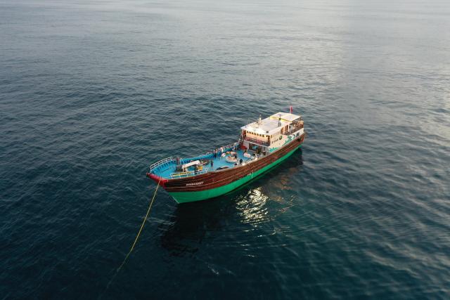 (261013) -- HAIKOU, Oct. 13, 2026 (Xinhua) -- This undated photo shows a wooden recreational fishing boat operated by Yang Liguo's team. TO GO WITH "Across China: Fishing tourism on the rise in historic south China port" (Xinhua)