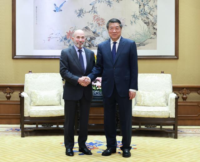 (261013) -- BEIJING, Oct. 13, 2026 (Xinhua) -- Chinese Vice Premier He Lifeng, also a member of the Political Bureau of the Communist Party of China Central Committee, meets with Evan Greenberg, executive vice chair of the National Committee on U.S.-China Relations (NCUSCR), at the Diaoyutai State Guesthouse in Beijing, capital of China, Oct. 12, 2026. (Xinhua/Wang Ye)