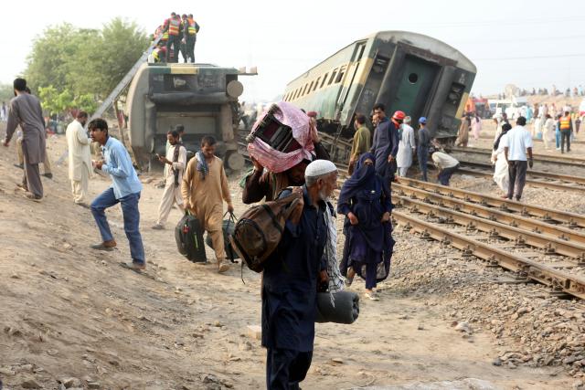 (261013) -- MULTAN, Oct. 13, 2026 (Xinhua) -- People are evacuated from the site of a train derailment accident in Multan district of Punjab province, Pakistan, Oct. 13, 2026. At least five passengers were killed and 30 others injured after all 14 carriages of a passenger train derailed in Pakistan's eastern Punjab province early Tuesday morning, police said.
   "The accident occurred in Multan district when the Rehman Baba Express, traveling from the southern port city of Karachi to the northwestern city of Peshawar, went off the tracks," police sources from the district told Xinhua. (Photo by Ibrahim Mansoor/Xinhua)