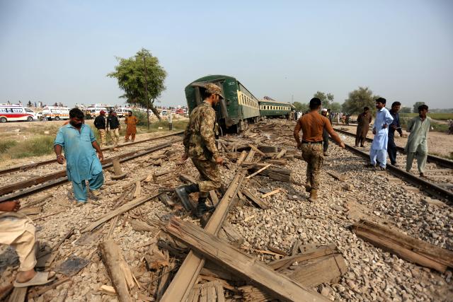(261013) -- MULTAN, Oct. 13, 2026 (Xinhua) -- People are seen at the site of a train derailment accident in Multan district of Punjab province, Pakistan, Oct. 13, 2026. At least five passengers were killed and 30 others injured after all 14 carriages of a passenger train derailed in Pakistan's eastern Punjab province early Tuesday morning, police said.
   "The accident occurred in Multan district when the Rehman Baba Express, traveling from the southern port city of Karachi to the northwestern city of Peshawar, went off the tracks," police sources from the district told Xinhua. (Photo by Ibrahim Mansoor/Xinhua)