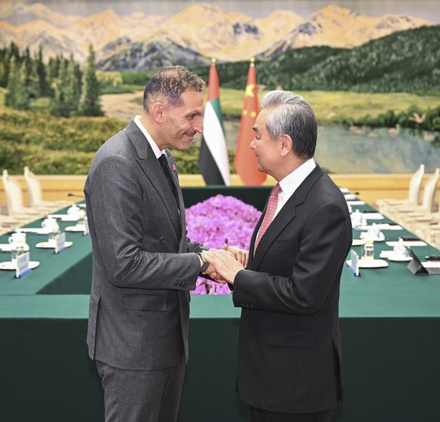 (261013) -- BEIJING, Oct. 13, 2026 (Xinhua) -- Wang Yi, a member of the Political Bureau of the Communist Party of China Central Committee and director of the Office of the Central Commission for Foreign Affairs, meets with Khaldoon Khalifa Al Mubarak, special envoy of the president of the United Arab Emirates (UAE) to China, in Beijing, capital of China, Oct. 13, 2026. (Xinhua/Zhang Ling)