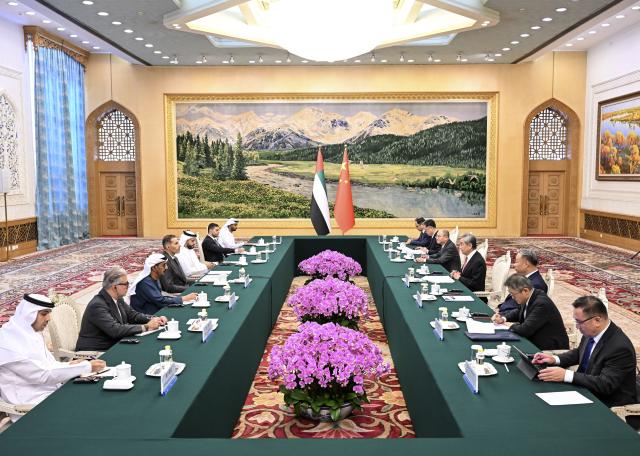(261013) -- BEIJING, Oct. 13, 2026 (Xinhua) -- Wang Yi, a member of the Political Bureau of the Communist Party of China Central Committee and director of the Office of the Central Commission for Foreign Affairs, meets with Khaldoon Khalifa Al Mubarak, special envoy of the president of the United Arab Emirates (UAE) to China, in Beijing, capital of China, Oct. 13, 2026. (Xinhua/Zhang Ling)