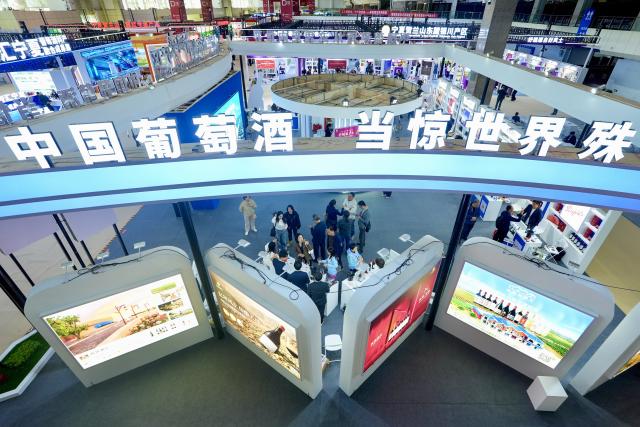 (261013) -- YINCHUAN, Oct. 13, 2026 (Xinhua) -- People visit the sixth China (Ningxia) International Wine Culture and Tourism Expo in Yinchuan, northwest China's Ningxia Hui Autonomous Region, Oct. 13, 2026.
  From Oct. 12 to 14, the expo is held in Yinchuan, attracting 84 world-renowned wineries and enterprises from distinctive production areas in 16 countries. It has also drawn a total of 146 leading domestic wineries from Ningxia and other core production areas in China.
 The local wine industry has also become a driver of tourism. Wineries in Ningxia receive more than 3.7 million tourist visits each year, generating combined benefits of over 50 billion yuan (around 7.4 billion U.S. dollars). (Xinhua/Yang Zhisen)