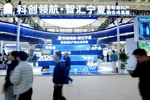 (261013) -- YINCHUAN, Oct. 13, 2026 (Xinhua) -- People visit the sixth China (Ningxia) International Wine Culture and Tourism Expo in Yinchuan, northwest China's Ningxia Hui Autonomous Region, Oct. 13, 2026.
  From Oct. 12 to 14, the expo is held in Yinchuan, attracting 84 world-renowned wineries and enterprises from distinctive production areas in 16 countries. It has also drawn a total of 146 leading domestic wineries from Ningxia and other core production areas in China.
 The local wine industry has also become a driver of tourism. Wineries in Ningxia receive more than 3.7 million tourist visits each year, generating combined benefits of over 50 billion yuan (around 7.4 billion U.S. dollars). (Xinhua/Yang Zhisen)
