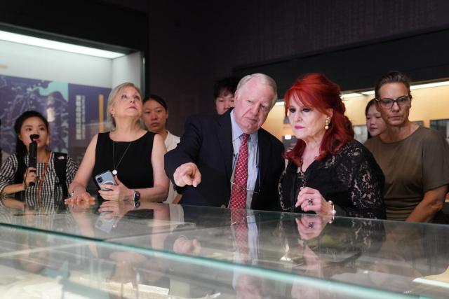 (261013) -- NANCHANG, Oct. 13, 2026 (Xinhua) -- Descendants of the rescued Doolittle Raid participants view a historical exhibition in Shangrao, east China's Jiangxi Province, Oct. 10, 2026. (Xinhua/Zhou Mi)