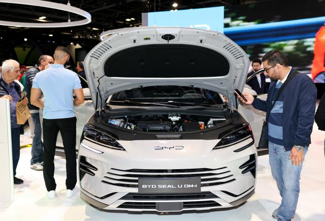 (261013) -- PARIS, Oct. 13, 2026 (Xinhua) -- People visit the booth of Chinese automaker BYD during the 2026 Paris Motor Show in Paris, France, on Oct. 13, 2026. The 91st Paris Motor Show opened in the French capital on Monday, with a record number of Chinese automakers taking part to showcase their latest models and technologies. (Xinhua/Wu Huiwo)