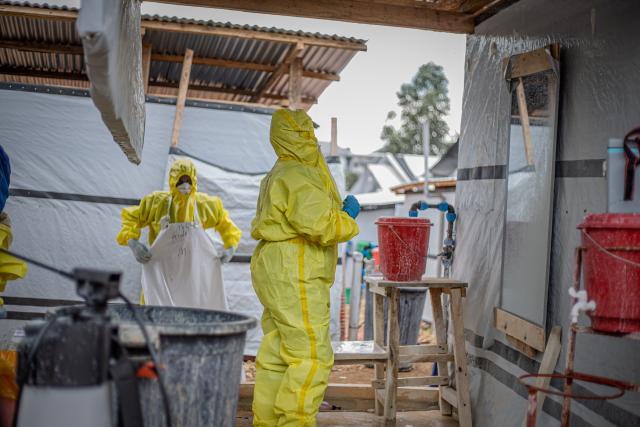 (261013) -- BUNIA, Oct. 13, 2026 (Xinhua) -- Health workers put on protective suits at an Ebola treatment center in Bunia, capital of Ituri Province in the Democratic Republic of the Congo (DRC), on Oct. 12, 2026. The Democratic Republic of the Congo (DRC) has recorded more than 9,000 confirmed cases of Ebola since the outbreak was declared on May 15, with the death toll rising to 4,381, according to the latest situation report released Tuesday.
   No vaccine or treatment has yet been specifically approved for the Bundibugyo ebolavirus, although clinical trials are underway. (Xinhua)