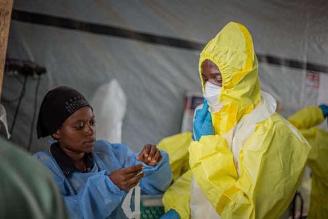 (261013) -- BUNIA, Oct. 13, 2026 (Xinhua) -- Health workers put on protective suits at an Ebola treatment center in Bunia, capital of Ituri Province in the Democratic Republic of the Congo (DRC), on Oct. 12, 2026. The Democratic Republic of the Congo (DRC) has recorded more than 9,000 confirmed cases of Ebola since the outbreak was declared on May 15, with the death toll rising to 4,381, according to the latest situation report released Tuesday.
   No vaccine or treatment has yet been specifically approved for the Bundibugyo ebolavirus, although clinical trials are underway. (Xinhua)