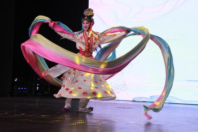 (261013) -- HARARE, Oct. 13, 2026 (Xinhua) -- An artist performs on stage during the "Wu Opera in Africa" showcase in Harare, Zimbabwe, on Oct. 12, 2026. TO GO WITH "Feature: Chinese Wu Opera bridges cultures in Zimbabwe" (Xinhua/Tafara Mugwara)