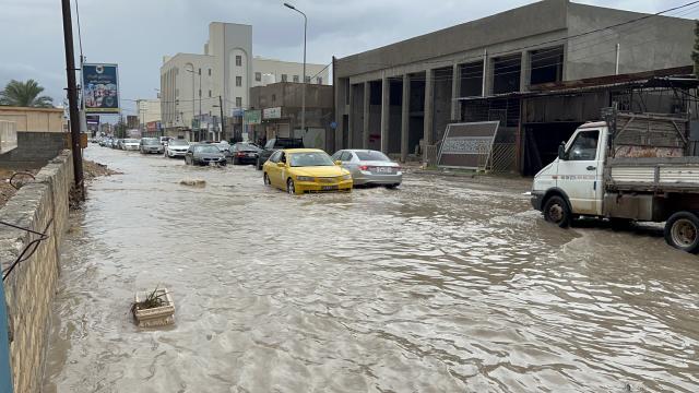 (261013) -- TRIPOLI, Oct. 13, 2026 (Xinhua) -- This photo taken with a mobile phone shows vehicles running on a flooded road after heavy rains in Tripoli, Libya, Oct. 13, 2026. (Photo by Hazem Turkia/Xinhua)