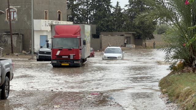 (261013) -- TRIPOLI, Oct. 13, 2026 (Xinhua) -- This photo taken with a mobile phone shows vehicles running on a flooded road after heavy rains in Tripoli, Libya, Oct. 13, 2026. (Photo by Hazem Turkia/Xinhua)