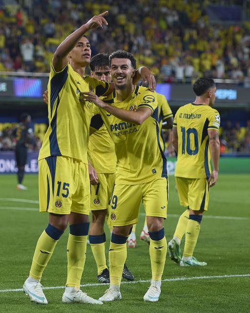 (261014) -- VILLARREAL, Oct. 14, 2026 (Xinhua) -- Players of Villarreal celebrate a goal during the UEFA Champions League League Stage match between Villarreal and Napoli in Villarreal, Spain, Oct. 13, 2026. (Str/Xinhua)