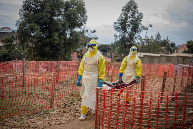 (261014) -- BEIJING, Oct. 14, 2026 (Xinhua) -- Health workers transport an Ebola patient at an Ebola treatment center in Bunia, capital of Ituri Province in the Democratic Republic of the Congo (DRC), on Oct. 12, 2026. The Democratic Republic of the Congo (DRC) has recorded more than 9,000 confirmed cases of Ebola since the outbreak was declared on May 15, with the death toll rising to 4,381, according to the latest situation report released Tuesday.
   No vaccine or treatment has yet been specifically approved for the Bundibugyo ebolavirus, although clinical trials are underway. (Xinhua)