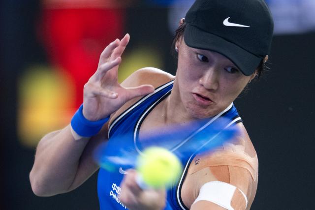 (261014) -- BEIJING, Oct. 14, 2026 (Xinhua) -- Wang Xiyu hits a return during the women's sinlges round of 64 match between Wang Xiyu of China and Wang Xinyu of China at the 2026 Wuhan Open tennis tournament in Wuhan, capital of central China's Hubei Province, Oct. 12, 2026. (Xinhua/Xiao Yijiu)