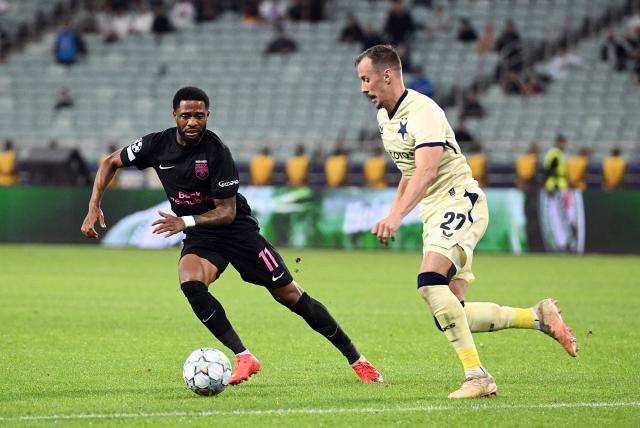 (261014) -- BAKU, Oct. 14, 2026 (Xinhua) -- Kaheem Parris (L) of Sabah FK vies for the ball with Tomas Vlcek of Slavia Praha during the UEFA Champions League League Stage match in Baku, Azerbaijan, on Oct. 13, 2026. (Photo by Tofik Babayev/Xinhua)