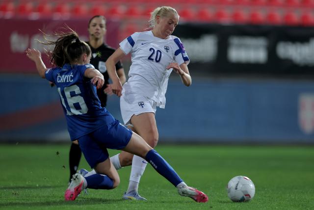 (261014) -- BELGRADE, Oct. 14, 2026 (Xinhua) -- Serbia's Mina Cavic (L) vies with Finland's Eveliina Summanen during European Qualifiers Play Off for 2027 FIFA Women's World Cup football match between Serbia and Finland, in Stara Pazova, Serbia, on Oct. 13, 2026. (Photo by Predrag Milosavljevic/Xinhua)