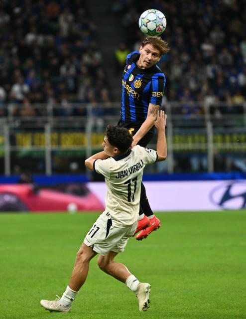 (261014) -- MILAN, Oct. 14, 2026 (Xinhua) -- Club Brugge's Jan Virgili (bottom) vies with Inter Milan's Nicolo Barella during the UEFA Champions League League Stage football match between Inter Milan and Club Brugge in Milan, Italy, Oct. 13, 2026. (Photo by Augusto Casasoli/Xinhua)
