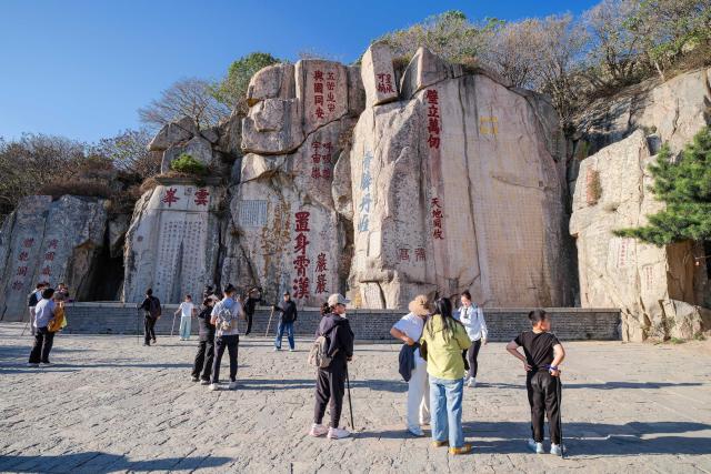 (261014) -- TAI'AN, Oct. 14, 2026 (Xinhua) -- This photo taken on Oct. 7, 2026 shows tourists visiting the Mount Tai in Tai'an City, east China's Shandong Province. Mount Tai, a UNESCO World Heritage Site, is one of China's most renowned mountains, known for its historical, cultural, aesthetic, and scientific significance. (Xinhua/Chen Yehua)