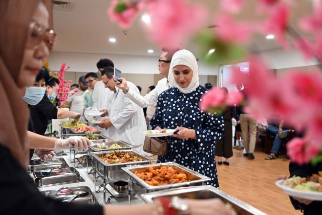 (261014) -- HAWALLI GOVERNORATE, Oct. 14, 2026 (Xinhua) -- People participate in a Chinese culinary experience event in Hawalli Governorate, Kuwait, Oct. 13, 2026. Titled "The Taste of China: Jiaozi (Dumpling) Experience," the event was organized by the China Cultural Center in Kuwait to introduce traditional Chinese food culture to local residents. More than 100 people participated in the event. (Photo by Asad/Xinhua)