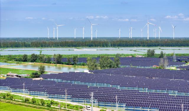 (261014) -- BEIJING, Oct. 14, 2026 (Xinhua) -- A drone photo taken on Sept. 9, 2026 shows a wind and solar power plant in Jinhu County of Huai'an City, east China's Jiangsu Province. (Photo by Liang Debin/Xinhua)