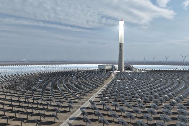 (261014) -- BEIJING, Oct. 14, 2026 (Xinhua) -- A drone photo taken on March 23, 2025 shows a 50-megawatt molten-salt solar thermal power plant in Naomaohu Township of Hami City, northwest China's Xinjiang Uygur Autonomous Region. (Xinhua/Ding Lei)