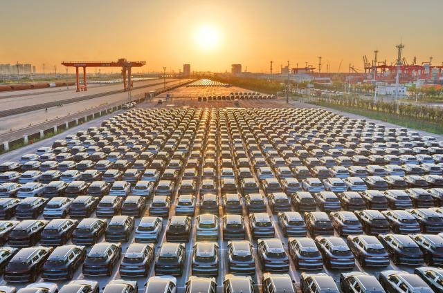 (261014) -- BEIJING, Oct. 14, 2026 (Xinhua) -- An aerial drone photo taken on May 29, 2026 shows new energy vehicles waiting to be loaded onto a vessel at a logistics base in Nantong City, east China's Jiangsu Province. (Photo by Xu Congjun/Xinhua)