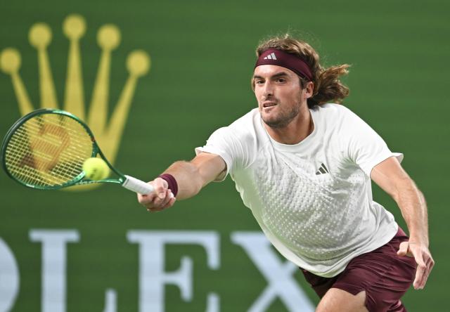(261014) -- SHANGHAI, Oct. 14, 2026 (Xinhua) -- Stefanos Tsitsipas of Greece hits a return during the men's round of 16 match against Daniil Medvedev of Russia at the 2026 ATP tour Shanghai Masters tennis tournament in Shanghai, China, Oct. 14, 2026. (Xinhua/Chen Haoming)