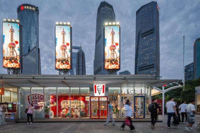 (261014) -- SHANGHAI, Oct. 14, 2026 (Xinhua) -- People walk past a KFC restaurant in downtown Shanghai, east China, June 15, 2026.
  TO GO WITH "Economic Watch: New wave of American fast-food chains bets on China's younger generation" (Xinhua)