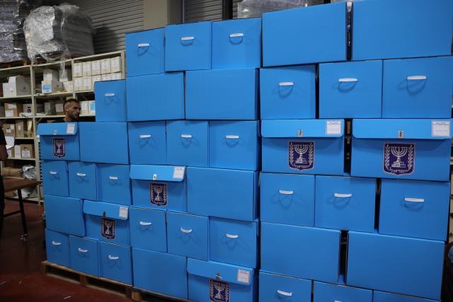 (261014) -- MODIIN, Oct. 14, 2026 (Xinhua) -- A worker arranges ballot boxes at a logistics center near the central Israeli city of Modiin, Oct. 14, 2026. The general elections for Israel's Knesset, the country's parliament, will be held on Oct. 27. All the preparations for the election are underway. (Photo by Gil Cohen Magen/Xinhua)