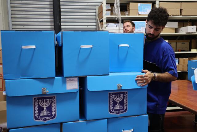 (261014) -- MODIIN, Oct. 14, 2026 (Xinhua) -- Workers arrange ballot boxes at a logistics center near the central Israeli city of Modiin, Oct. 14, 2026. The general elections for Israel's Knesset, the country's parliament, will be held on Oct. 27. All the preparations for the election are underway. (Photo by Gil Cohen Magen/Xinhua)