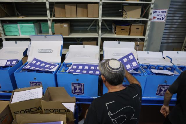 (261014) -- MODIIN, Oct. 14, 2026 (Xinhua) -- A worker prepares ballot boxes at a logistics center near the central Israeli city of Modiin, Oct. 14, 2026. The general elections for Israel's Knesset, the country's parliament, will be held on Oct. 27. All the preparations for the election are underway. (Photo by Gil Cohen Magen/Xinhua)