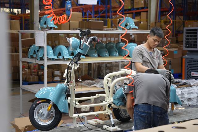 (261014) -- HANOI, Oct. 14, 2026 (Xinhua) -- Workers are busy at the production base of Aima in Bac Ninh province, Vietnam, July 16, 2026.
  Chinese electric motorcycle brands are becoming an increasingly common sight on the streets of Vietnam's major cities, as the country accelerates its shift toward greener urban transport.
  More Vietnamese residents have turned to electric motorcycles, with Chinese brands emerging as popular choices thanks to their competitive prices, diverse models and growing presence in the Vietnamese market. (Xinhua/Liu Ying)