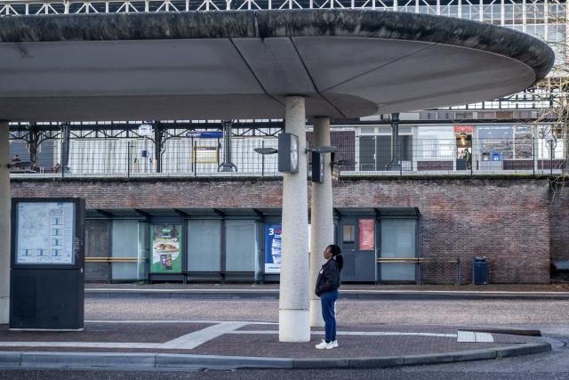 (261014) -- HENGELO, Oct. 14, 2026 (Xinhua) -- A woman is seen at a platform in Hengelo, the Netherlands, Oct. 14, 2026. Regional public transport services across most of the country were disrupted by strikes on Wednesday for demanding better working conditions and employee welfare. (Photo by Eric Brinkhorst/Xinhua)