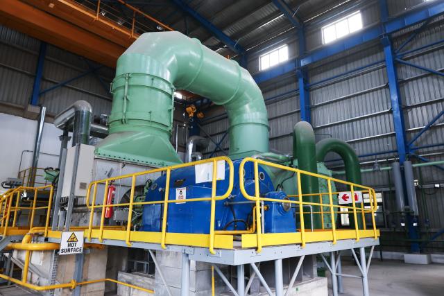 (261014) -- DURBAN, Oct. 14, 2026 (Xinhua) -- This photo taken on Aug. 18, 2026 shows a waste heat recovery power generation unit at Simuma Cement Plant in KwaZulu-Natal Province, South Africa. TO GO WITH "Roundup: Chinese green technologies revitalize South African cement plant" (Xinhua/Chen Wei)