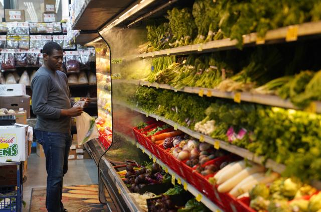 (261014) -- NEW YORK, Oct. 14, 2026 (Xinhua) -- A man stands in front of vegetable shelves at a store in New York, the United States, Oct. 14, 2026. U.S. consumer prices rose more than expected in September, driven by surging gasoline costs, with annual inflation reaching its highest level since May, the Labor Department said Wednesday. The consumer price index (CPI) rose 0.6 percent from August and 3.7 percent from a year earlier. Economists had forecast an annual increase of 3.6 percent. (Xinhua/Zhang Fengguo)