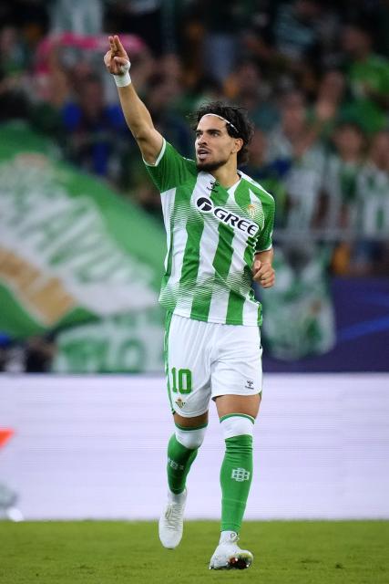 (261015) -- SEVILLE, Oct. 15, 2026 (Xinhua) -- Abde Ezzalzouli of Real Betis celebrates a goal during the UEFA Champions League match between Real Betis and Porto at La Cartuja Stadium in Seville, Spain, Oct. 14, 2026. (Str/Xinhua)