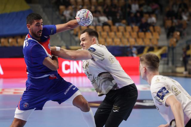 (261015) -- CELJE, Oct. 15, 2026 (Xinhua) -- Yahia Khaled Fathy Omar (L) of Paris Saint-Germain competes during the European Handball Federation (EHF) Champions League match between RK Celje Pivovarna Lasko and Paris Saint-Germain at Zlatorog Sports Hall in Celje, Slovenia, Oct.14, 2026. (Photo by Zeljko Stevanic/Xinhua)