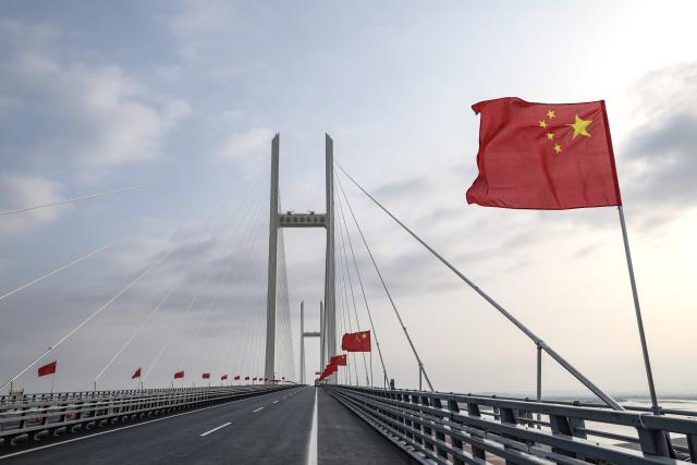 (261015) -- DANDONG, Oct. 15, 2026 (Xinhua) -- This photo taken on Oct. 15, 2026 shows a new bridge across the Yalu River, the border river of China and the Democratic People's Republic of Korea (DPRK). The opening ceremony for the new China-DPRK border bridge over Yalu River was held on Thursday. (Xinhua/Pan Yulong)