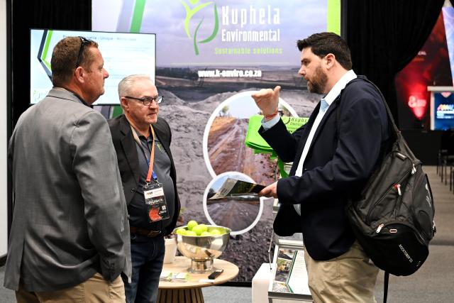 (261015) -- CAPE TOWN, Oct. 15, 2026 (Xinhua) -- People communicate at a mining exhibition during African Mining Week 2026 in Cape Town, South Africa, Oct. 14, 2026. African Mining Week (AMW) 2026 on Wednesday kicked off in Cape Town, South Africa, with a call to unlock the full value of Africa's mineral resources through greater regional cooperation, investment and industrial development.
   TO GO WITH "African Mining Week urges efforts to unlock full value of continental resources" (Photo by Xabiso Mkhabela/Xinhua)