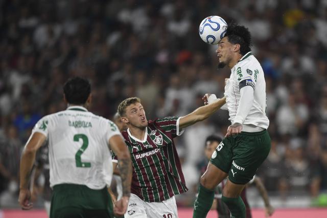 (261015) -- RIO DE JANEIRO, Oct. 15, 2026 (Xinhua) -- Gustavo Gomez (R) of Palmeiras heads the ball during the first leg of the Copa Libertadores semifinal football match between Brazil's Fluminense and Palmeiras at the Maracana stadium in Rio de Janeiro, Brazil, Oct. 14, 2026. (Photo by Daniel Ramalho/Xinhua)