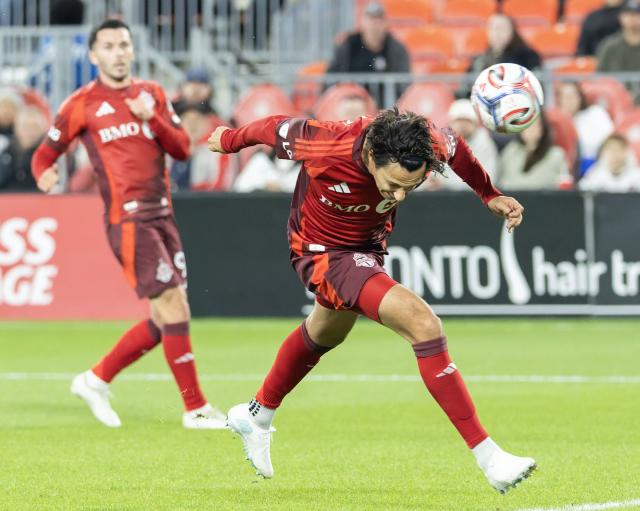 (261015) -- TORONTO, Oct. 15, 2026 (Xinhua) -- Daniel Salloi (R) of Toronto FC heads the ball during the 2026 Major League Soccer (MLS) regular season match between Toronto FC and Orlando City SC at BMO Field in Toronto, Canada, Oct. 14, 2026. (Photo by Zou Zheng/Xinhua)
