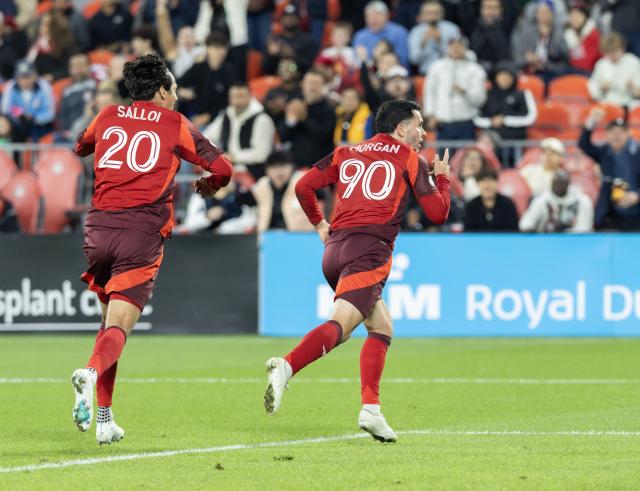 (261015) -- TORONTO, Oct. 15, 2026 (Xinhua) -- Lewis Morgan (R) of Toronto FC celebrates scoring during the 2026 Major League Soccer (MLS) regular season match between Toronto FC and Orlando City SC at BMO Field in Toronto, Canada, Oct. 14, 2026. (Photo by Zou Zheng/Xinhua)